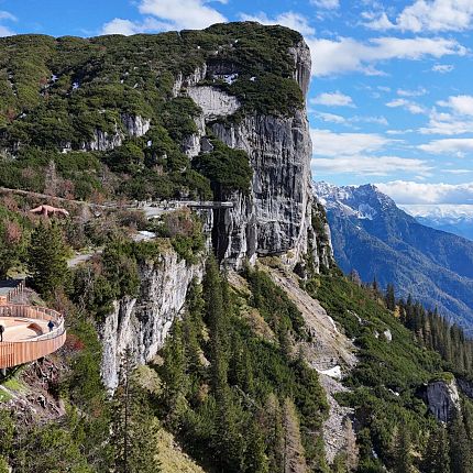 Mountain cliff with scenic view and overlook.